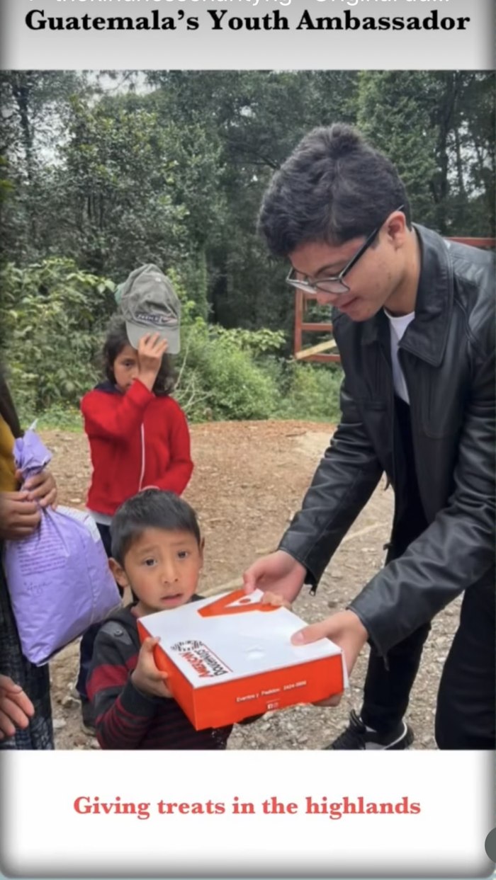Guatemala's Youth Ambassador giving treats to children in the highlands